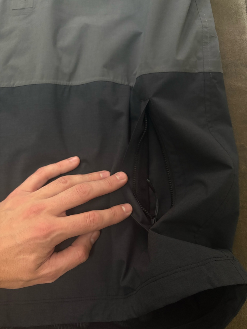 Vuori Oahu Rain Jacket. Two-Tone Hooded Rain Jacket in Dark Gray and Black - Picture 8 of 9